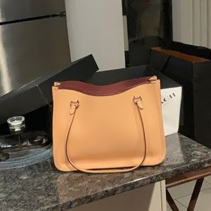 Coach light pink purse, 14” W X 10” H, gently used